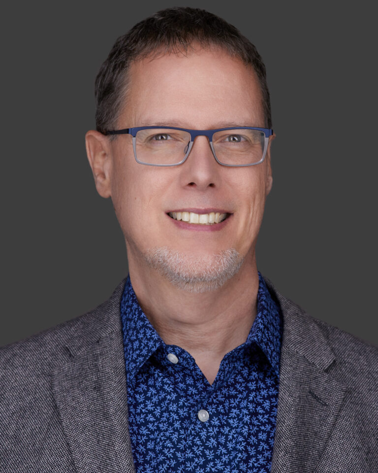 A headshot photo of Dr Cusic