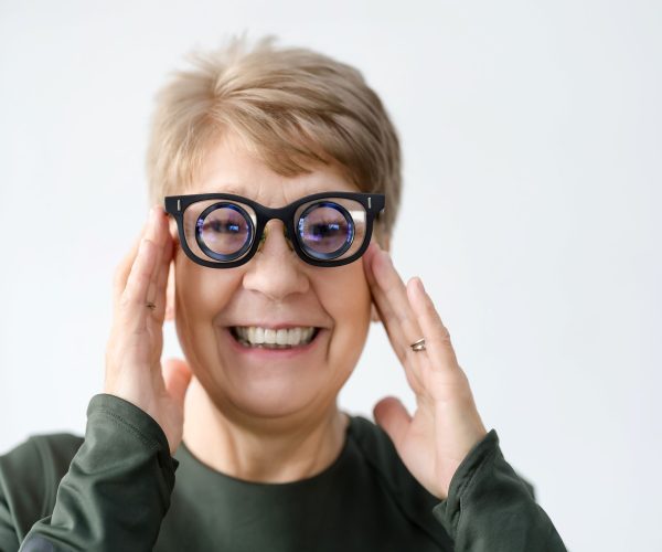 Woman wearing full diameter telescope glasses